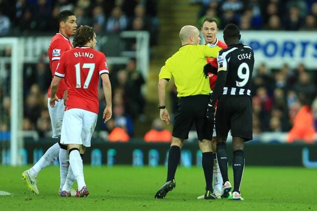 Referee Anthony Taylor restrains Papiss Cisse of Newcastle United as he attempts to square up to Jonny Evans of Manchester United ManU - Newcastle United vs. Manchester United ManU - Barclay s Premier League - St James Park - Newcastle - 04 03 2015 Pic PhilipxOldham Sportimage EDITORIAL USE ONLY. No use with unauthorised audio, video, data, fixture lists, club league logos or live services. Online in-match use limited to 120 images, no video emulation. No use in betting, games or single club league player publications.