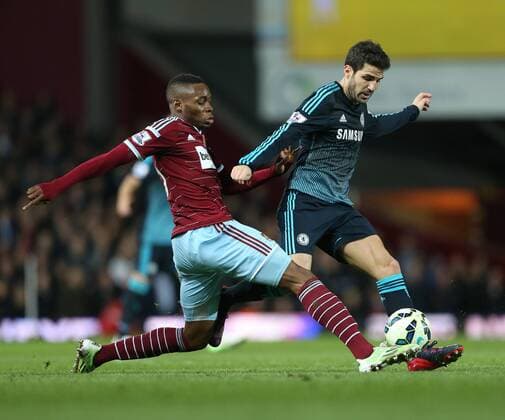 West Ham s Diafra Sakho tussles with Chelsea s Cesc Fabregas Barclays Premier League - - West Ham United vs FC Chelsea United - Upton Park - England - 4th March 2015 - Picture DavidxKlein Sportimage EDITORIAL USE ONLY. No use with unauthorised audio, video, data, fixture lists, club league logos or live services. Online in-match use limited to 120 images, no video emulation. No use in betting, games or single club league player publications.