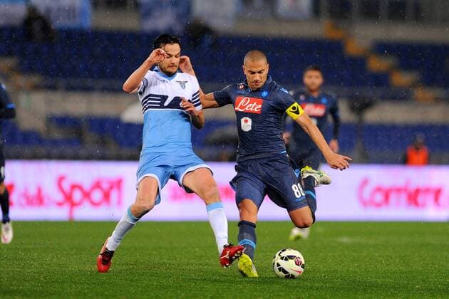 04.03.2015. Rome, Italy. Coppa Italia Semi Final. Lazio Rom vs SSC Neapel . Marco Parolo (Laz) challenges GÃ¶khan Inler (Nap) xGiuseppexMaffiax  ActionPlus11602327