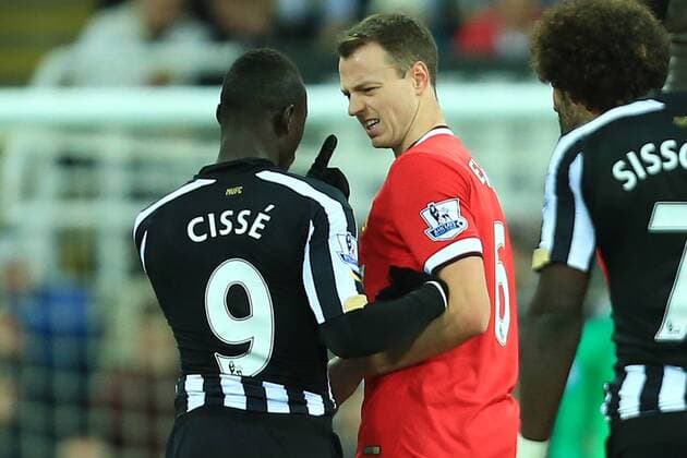 Papiss Cisse of Newcastle United points an accusing finger at Jonny Evans of Manchester United ManU - Newcastle United vs. Manchester United - Barclay s Premier League - St James Park - Newcastle - 04 03 2015 Pic Philip Oldham Sportimage EDITORIAL USE ONLY. No use with unauthorised audio, video, data, fixture lists, club league logos or live services. Online in-match use limited to 120 images, no video emulation. No use in betting, games or single club league player publications.