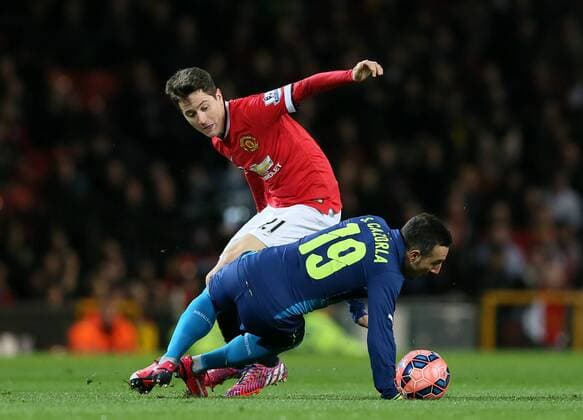 Early skirmish between Ander Herrera OF Manchester United ManU and Santi Cazorla of Arsenal - FA Cup Sixth Round - Manchester Utd vs Arsenal - Old Trafford Stadium - Manchester - England - 9th March 2015 - Picture Simon Bellis Sportimage EDITORIAL USE ONLY. No use with unauthorised audio, video, data, fixture lists, club league logos or live services. Online in-match use limited to 120 images, no video emulation. No use in betting, games or single club league player publications.