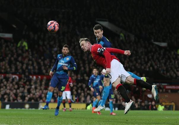 Wayne Rooney of Manchester United ManU heads the equalising goal 1-1 - FA Cup Sixth Round - Manchester Utd vs Arsenal - Old Trafford Stadium - Manchester - England - 9th March 2015 - Picture Simon Bellis Sportimage EDITORIAL USE ONLY. No use with unauthorised audio, video, data, fixture lists, club league logos or live services. Online in-match use limited to 120 images, no video emulation. No use in betting, games or single club league player publications.