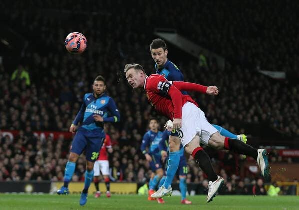 Wayne Rooney of Manchester United ManU heads the equalising goal 1-1 - FA Cup Sixth Round - Manchester Utd vs Arsenal - Old Trafford Stadium - Manchester - England - 9th March 2015 - Picture Simon Bellis Sportimage EDITORIAL USE ONLY. No use with unauthorised audio, video, data, fixture lists, club league logos or live services. Online in-match use limited to 120 images, no video emulation. No use in betting, games or single club league player publications.