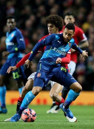 Francis Coquelin of Arsenal tussles with Mauroane Fellaini of Manchester United ManU - FA Cup Sixth Round - Manchester Utd vs Arsenal - Old Trafford Stadium - Manchester - England - 9th March 2015 - Picture Simon Bellis Sportimage EDITORIAL USE ONLY. No use with unauthorised audio, video, data, fixture lists, club league logos or live services. Online in-match use limited to 120 images, no video emulation. No use in betting, games or single club league player publications.