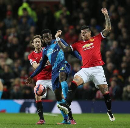 Danny Welbeck of Arsenal tackled by Daley Blind and Marcos Rojo of Manchester United ManU FA Cup Sixth Round - Manchester Utd vs Arsenal - Old Trafford Stadium - Manchester - England - 9th March 2015 - Picture Simon Bellis Sportimage EDITORIAL USE ONLY. No use with unauthorised audio, video, data, fixture lists, club league logos or live services. Online in-match use limited to 120 images, no video emulation. No use in betting, games or single club league player publications.