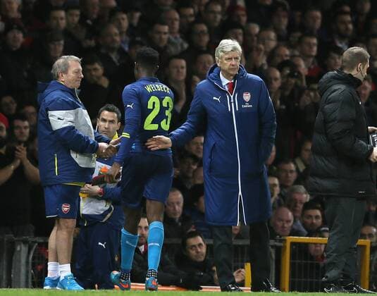 A pat on the back from Arsene Wenger manager of Arsenal for Danny Welbeck of Arsenal as he is substituted - FA Cup Sixth Round - Manchester Utd vs Arsenal - Old Trafford Stadium - Manchester - England - 9th March 2015 - Picture Simon Bellis Sportimage EDITORIAL USE ONLY. No use with unauthorised audio, video, data, fixture lists, club league logos or live services. Online in-match use limited to 120 images, no video emulation. No use in betting, games or single club league player publications.