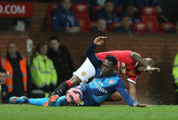 Danny Welbeck of Arsenal battles with Ashley Young of Manchester United ManU - FA Cup Sixth Round - Manchester Utd vs Arsenal - Old Trafford Stadium - Manchester - England - 9th March 2015 - Picture Simon Bellis Sportimage EDITORIAL USE ONLY. No use with unauthorised audio, video, data, fixture lists, club league logos or live services. Online in-match use limited to 120 images, no video emulation. No use in betting, games or single club league player publications.