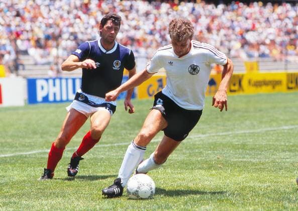 Football - 1986 World Cup - Group E: West Germany 2 Scotland 1 Germany s Rudi Voller and Scotland s David Narey at Estadio La Corregidora, Queretaro, Mexico. 08 06 1986 