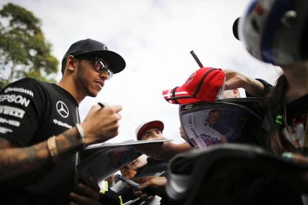 March 12, 2015 - Melbourne, Australia - LEWIS HAMILTON of Great Britain and Mercedes AMG Petronas F1 Team signs autographs for the fans during preparations of the 2015 Australian Grand Prix at Albert Park Circuit in Melbourne, Australia. F1 2015 - Australian Grand Prix - Preparations - ZUMAg147