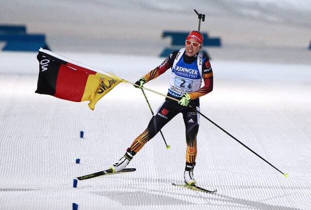 KONTIOLAHTI, FINLAND. MARCH 13, 2015. Gold medalist, biathlete Laura Dahlmeier of Germany waves her national flag as she crosses the finish line in the 2015 IBU Biathlon World Championships women s 4x6km relay in Kontiolahti, Finland. Stanislav Krasilnikov TASS  RE15E509