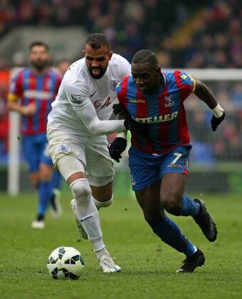 Football - 2014 2015 Premier League - Crystal Palace vs. Queens Park Rangers Sandro of Queens Park Rangers tries to stop Yannick Bolasie of Crystal Palace from setting up another Palace attack Selhurst Park Colorsport Shaun Boggust 