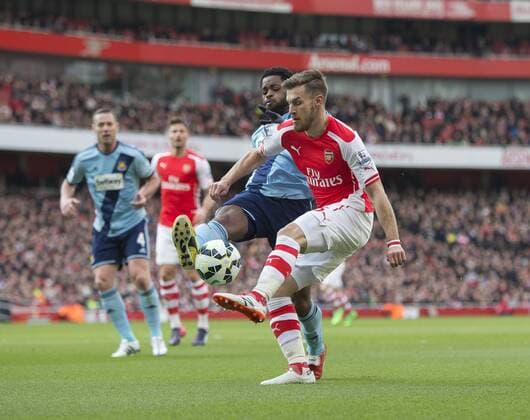 14.03.2015. London, England. Barclays Premier League. Arsenal versus West Ham. West Ham United s Alexandre Song blocks the attempted shot from Arsenal s Aaron Ramsey. xNigelxCookex  ActionPlus11604757