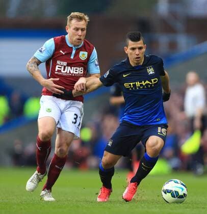 Scott Arfield of Burnley battles Sergio Kun Aguero of Manchester City - Burnley vs. Manchester City - Barclay s Premier League - Turf Moor - Burnley - 14 03 2015 Pic Philip Oldham Sportimage EDITORIAL USE ONLY. No use with unauthorised audio, video, data, fixture lists, club league logos or live services. Online in-match use limited to 120 images, no video emulation. No use in betting, games or single club league player publications.