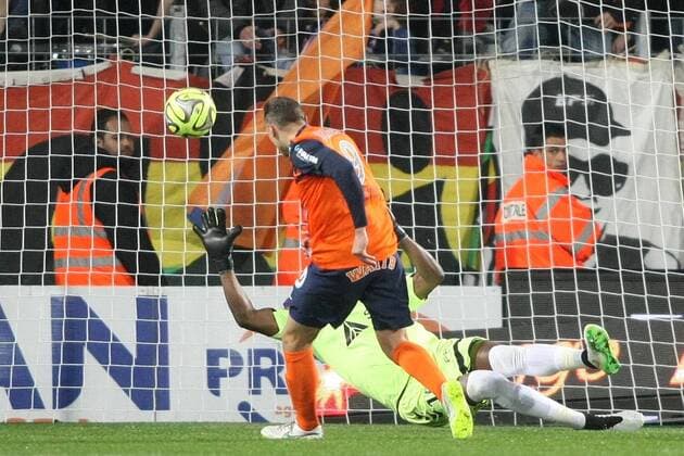 Kevin BERIGAUD (Montpellier) face Agassa kossi FOOTBALL : Montpellier vs Reims - Ligue 1 - 14 03 2015 RichardGosselin Panoramic 