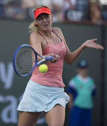 (150315) -- INDIAN WELLS, Russia s Maria Sharapova returns a shot to Belgium s YaninaWickmayer during the women s singles second round match at the 2015 BNP Paribas Open at the Indian Wells Tennis Garden, the United States, March 14, 2015. Maria Sharapova won 2-0. ) (SP)US-INDIAN WELLS-TENNIS-BNP PARIBAS OPEN YangxLei 