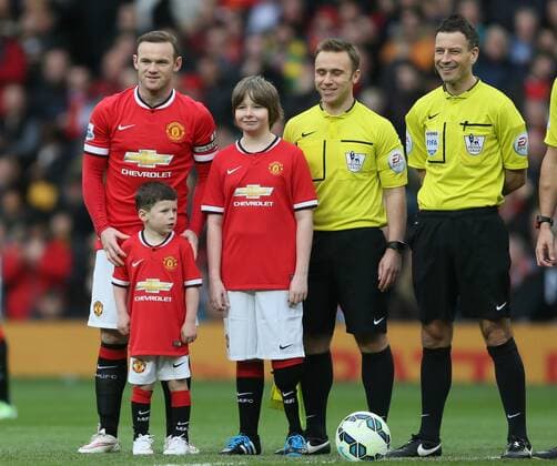 Wayne Rooney of Manchester United ManU stands with his son Kai in front of him for the official photograph - Barclays Premier League - Manchester Utd vs Tottenham - Old Trafford Stadium - Manchester - England - 15th March 2015 - Picture Simon Bellis Sportimage EDITORIAL USE ONLY. No use with unauthorised audio, video, data, fixture lists, club league logos or live services. Online in-match use limited to 120 images, no video emulation. No use in betting, games or single club league player publications.