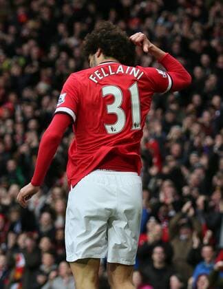 Goalscorer Mauroane Fellaini of Manchester United ManU points to his name on his shirt - Barclays Premier League - Manchester Utd vs Tottenham - Old Trafford Stadium - Manchester - England - 15th March 2015 - Picture Simon Bellis Sportimage EDITORIAL USE ONLY. No use with unauthorised audio, video, data, fixture lists, club league logos or live services. Online in-match use limited to 120 images, no video emulation. No use in betting, games or single club league player publications.