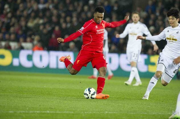 Football - 2014 2015 Premier League - Swansea City vs. LIVERPOOL Liverpool striker Daniel Sturridge shoots at goal at the Liberty Stadium. Â© winston bynorth COLORSPORT WINSTON BYNORTH 