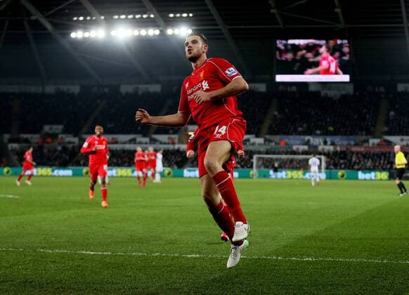Jordan Henderson of Liverpool celebrates scoring the first goal - Barclays Premier League - Swansea City vs Liverpool - Liberty Stadium - Swansea - Wales - 16th March 2015 - Picture Simon Bellis Sportimage EDITORIAL USE ONLY. No use with unauthorised audio, video, data, fixture lists, club league logos or live services. Online in-match use limited to 120 images, no video emulation. No use in betting, games or single club league player publications.