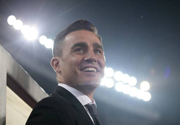 Head coach Fabio Cannavaro of Guangzhou Evergrande smiles as he watches his team competing against Kashima Antlers during their 2015 AFC Champions League Group H third round match in Guangzhou city, south China s Guangdong province, 18 March 2015. the top of Group H in the AFC Champions League.  20150318_33142