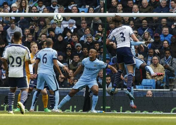 21.03.2015. Manchester, England. Barclays Premier League. Manchester City versus West Bromwich Albion. West Bromwich defender Jonas Olsson (3) heads over the City bar. xAlanxMartinx  ActionPlus11606919