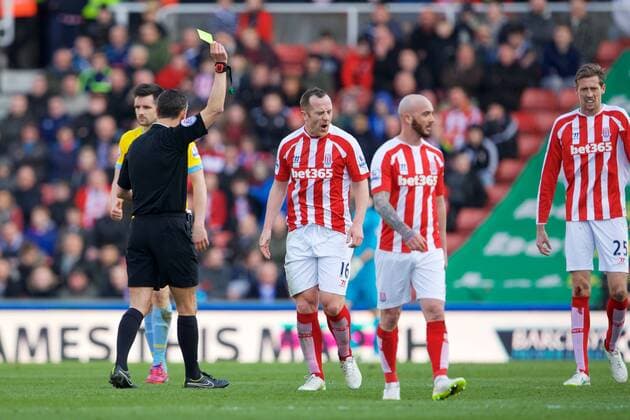 21.03.2015. Stoke, England. Barclays Premier League. Stoke City versus Crystal Palace. Stoke City midfielder Charlie Adam gets a yellow card. xTimxWilliamsx  ActionPlus11606969