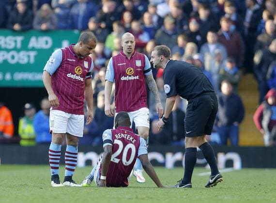 Christian Benteke of Aston Villa struggles with an injury in the second half - Football - Barclays Premier League - Aston Villa vs Swansea City - Villa Park Birmingham - Season 2014 15 - 21st March 2015 - Photo Malcolm Couzens Sportimage EDITORIAL USE ONLY. No use with unauthorised audio, video, data, fixture lists, club league logos or live services. Online in-match use limited to 120 images, no video emulation. No use in betting, games or single club league player publications.