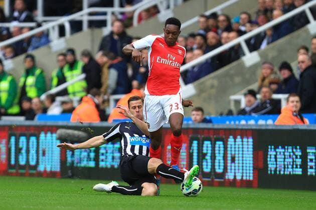 Arsenal s Danny Welbeck skips past Ryan Taylor of Newcastle United - Newcastle United vs. Arsenal - Barclay s Premier League - St James Park - Newcastle - 21 03 2015 Pic Philip Oldham Sportimage EDITORIAL USE ONLY. No use with unauthorised audio, video, data, fixture lists, club league logos or live services. Online in-match use limited to 120 images, no video emulation. No use in betting, games or single club league player publications.
