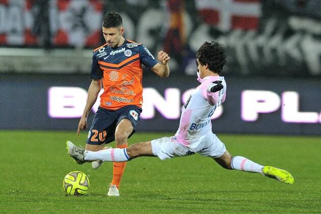Yeltsin Tejeda (etg) vs Morgan Sanson (montpelllier) FOOTBALL : Evian Thonon Gaillard vs Montpellier - Ligue 1 - 21 03 2015 FredericChambert Panoramic 