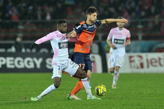 Clarck Nsikulu (etg) vs Paul Lasne (montpelllier) FOOTBALL : Evian Thonon Gaillard vs Montpellier - Ligue 1 - 21 03 2015 FredericChambert Panoramic 