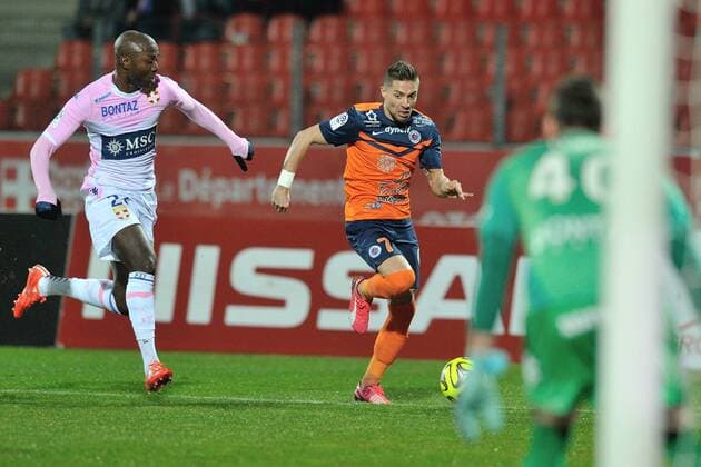 Cedric Mongongu (etg) vs Anthony Mounier (montpelllier) FOOTBALL : Evian Thonon Gaillard vs Montpellier - Ligue 1 - 21 03 2015 FredericChambert Panoramic 