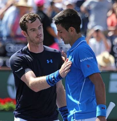 Novak Djokovic (R) of Serbia meets Andy Murray of Great Britain at the net after their men s semifinal match at the BNP Paribas Open in Indian Wells, California on March 21, 2015.  IDW20150321719 DAVIDxSILPA