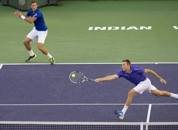 Vasek Pospisil of Canada and Jack Sock (R) of the United States compete during the men s double final match on the BNP Paribas Open tennis at the Indian Wells Tennis Garden in Indian Wells, California, the United States on March 21, 2015. Pospisil and Sock won 2-1. (SP)US-INDIAN WELLS-TENNIS-BNP PARIBAS OPEN-MEN S DOUBLE YangxLeic 