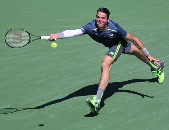 Milos Raonic of Canada hits a shot during his men s semifinal match at the BNP Paribas Open in Indian Wells, California on March 21, 2015.  IDW20150321722 DAVIDxSILPA