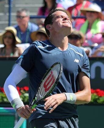 Milos Raonic of Canada reacts after a shot during his men s semifinal match at the BNP Paribas Open in Indian Wells, California on March 21, 2015.  IDW20150321739 DAVIDxSILPA