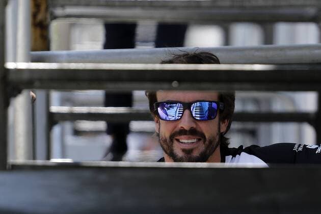 March 26, 2015 - Kuala Lumpur, Malaysia - Spanish F1 driver Fernando Alonso of Mc Laren walks to his team hospitality area ahead of Malaysian Formula One at Sepang Interational Circuit (SIC) in Malaysia on 26 March 2015. Alonso has passed all mandatory fitness tests and has been declared fit to race in this weekend Malaysia Grand Prix. Malaysian Formula One  - ZUMAn230