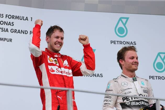 29.03.2015- Race, Sebastian Vettel (GER) Scuderia Ferrari SF15-T race winner and 2nd position Lewis Hamilton (GBR) Mercedes AMG F1 W06 Malaysian Grand Prix, Sepang 26 - 29 March 2015 
