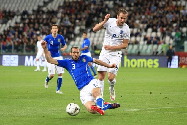 Giorgio Chiellini of Italy battles Harry Kane of England - Italy - England in Turin EDITORIAL USE ONLY. No use with unauthorised audio, video, data, fixture lists, club league logos or live services. Online in-match use limited to 120 images, no video emulation. No use in betting, games or single club league player publications.