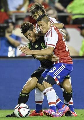March 31, 2015 - Kansas City, MO, USA - Mexico s Jonathan Dos Santos (8) battles for possession with Paraguay s Richard Ortiz (23) in the first half during a friendly on Tuesday, March 31, 2015, at Arrowhead Stadium in Kansas City, Mo. Paraguay vs. Mexico - ZUMAm67_