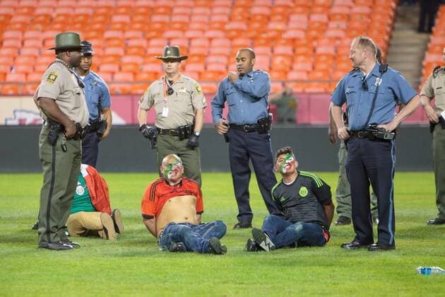 March 31, 2015: Police surround fans under arrest after several rushed the field after the CONCACAF international exhibition soccer game between Mexico and Paraguay at Arrowhead Stadium in Kansas City, Missouri. Mexico won 1-0 SOCCER: MAR 31 Paraguay v Mexico Icon1503310376 EDITORIAL USE ONLY
