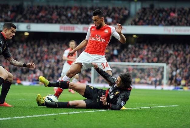 Aktuell Fußball, England, Premier League, FC Arsenal - FC Liverpool Francis Coquelin of Arsenal is challenged by Lazar Markovic of Liverpool Barclays Premier League Arsenal vs Liverpool Emirates Stadium London England 4th April 2015 Pic Robin Parker Sportimage EDITORIAL USE ONLY. No use with unauthorised audio, video, data, fixture lists, club league logos or live services. Online in-match use limited to 120 images, no video emulation. No use in betting, games or single club league player publications. DSC_1199.JPG