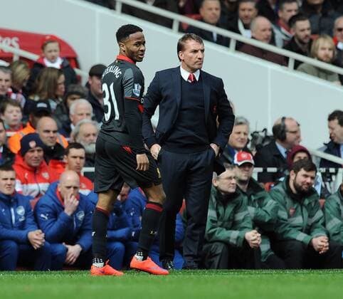 Aktuell Fußball, England, Premier League, FC Arsenal - FC Liverpool Raheem Sterling of Liverpool walks past Liverpool Manager Brendan Rodgers Barclays Premier League Arsenal vs Liverpool Emirates Stadium London England 4th April 2015 Pic Robin Parker Sportimage EDITORIAL USE ONLY. No use with unauthorised audio, video, data, fixture lists, club league logos or live services. Online in-match use limited to 120 images, no video emulation. No use in betting, games or single club league player publications. TM3_8162.JPG