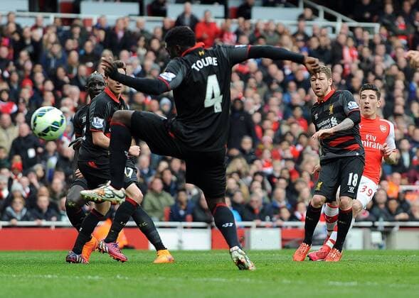 Hector Bellerin of Arsenal celebrates scoring the opening goal of the game - Barclays Premier League - Arsenal vs Liverpool - Emirates Stadium - London - England - 4th April 2015 - Pic Robin Parker Sportimage EDITORIAL USE ONLY. No use with unauthorised audio, video, data, fixture lists, club league logos or live services. Online in-match use limited to 120 images, no video emulation. No use in betting, games or single club league player publications. DSC_1263.JPG