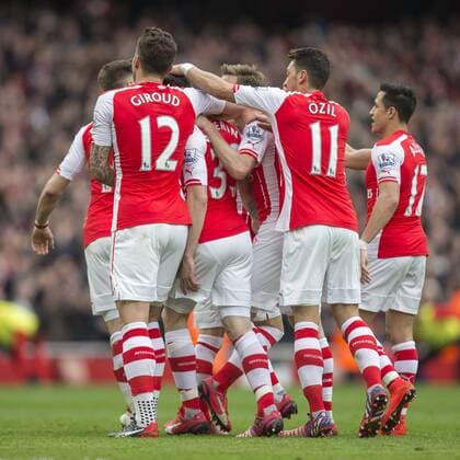 04.04.2015. London, England. Barclays Premier League. Arsenal versus Liverpool. Arsenal players celebrate their first goal scored by H& xe9;ctor Beller& xed;n. xNigelxCookex  ActionPlus11610468