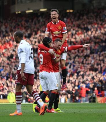 Wayne Rooney of Manchester United ManU celebrates scoring his sides second goal - Manchester United vs. Aston Villa - Barclay s Premier League - Old Trafford - Manchester - 04 04 2015 Pic Philip Oldham Sportimage EDITORIAL USE ONLY. No use with unauthorised audio, video, data, fixture lists, club league logos or live services. Online in-match use limited to 120 images, no video emulation. No use in betting, games or single club league player publications.