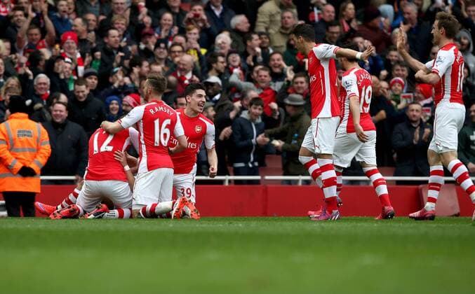 Players of Arsenal celebrate their third goal during the Barclays Premier League match between Arsenal and Liverpool at the Emirates Stadium in London, England on April 4, 2015. Arsenal won 4-1. ) FOR EDITORIAL USE ONLY. NOT FOR SALE FOR MARKETING OR ADVERTISING CAMPAIGNS. NO USE WITH UNAUTHORIZED AUDIO, VIDEO, DATA, FIXTURE LISTS, CLUB LEAGUE LOGOS OR LIVE SERVICES. ONLINE IN-MATCH USE LIMITED TO 45 IMAGES, NO VIDEO EMULATION. NO USE IN BETTING, GAMES OR SINGLE CLUB LEAGUE PLAYER PUBLICATIONS.? (SP)UK-LONDON-SOCCER-BARCLAYS PREMIER LEAGUE-ARSENAL VS LIVERPOOL HanxYan 