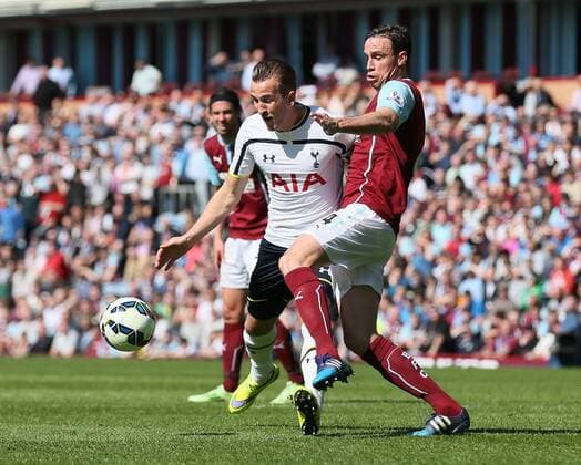 Harry Kane of Tottenham tackled by Michael Duff of Burnley - Barclays Premier League - Burnley vs Tottenham - Turf Moor Stadium - Burnley - England - 5th April 2015 - Picture Simon Bellis Sportimage EDITORIAL USE ONLY. No use with unauthorised audio, video, data, fixture lists, club league logos or live services. Online in-match use limited to 120 images, no video emulation. No use in betting, games or single club league player publications.