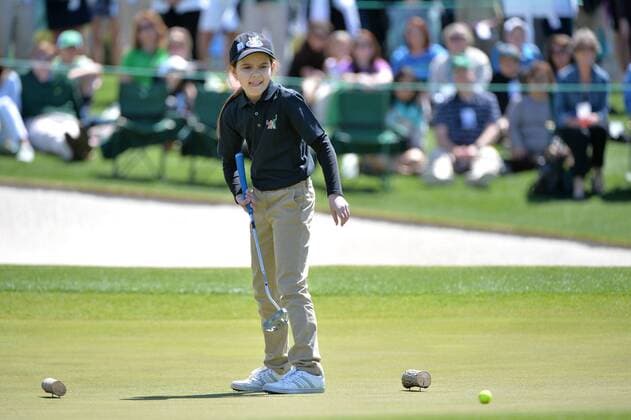 Effie Perakis, of Glenview, Illinois, reacts as she putts during the 7-9 girls division of the Drive, Chip and Putt National Finals during Masters week at Augusta, National in Augusta, Georgia on April 5, 2015.  WAP20150405310 KEVINxDIETSCH