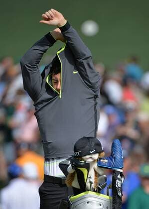 Rory McIlroy takes off his jacket during a practice round prior to the 2015 Masters Tournament at Augusta, National in Augusta, Georgia on April 6, 2015. The Masters will start on Thursday, April 9.  AUG20150406315 KEVINxDIETSCH
