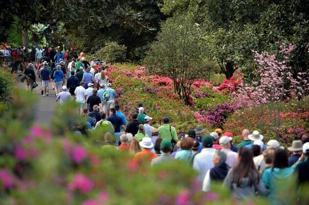 Patrons walk between blooming azaleas during a practice round prior to the 2015 Masters Tournament at Augusta, National in Augusta, Georgia on April 6, 2015.  AUG20150406320 KEVINxDIETSCH